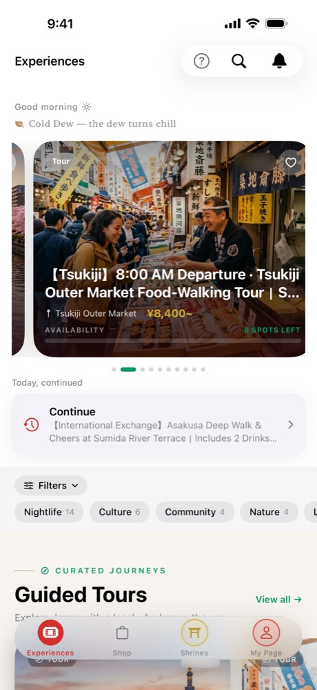 The Experiences tab in the app, with a Tsukiji market walking tour and other bookable experiences